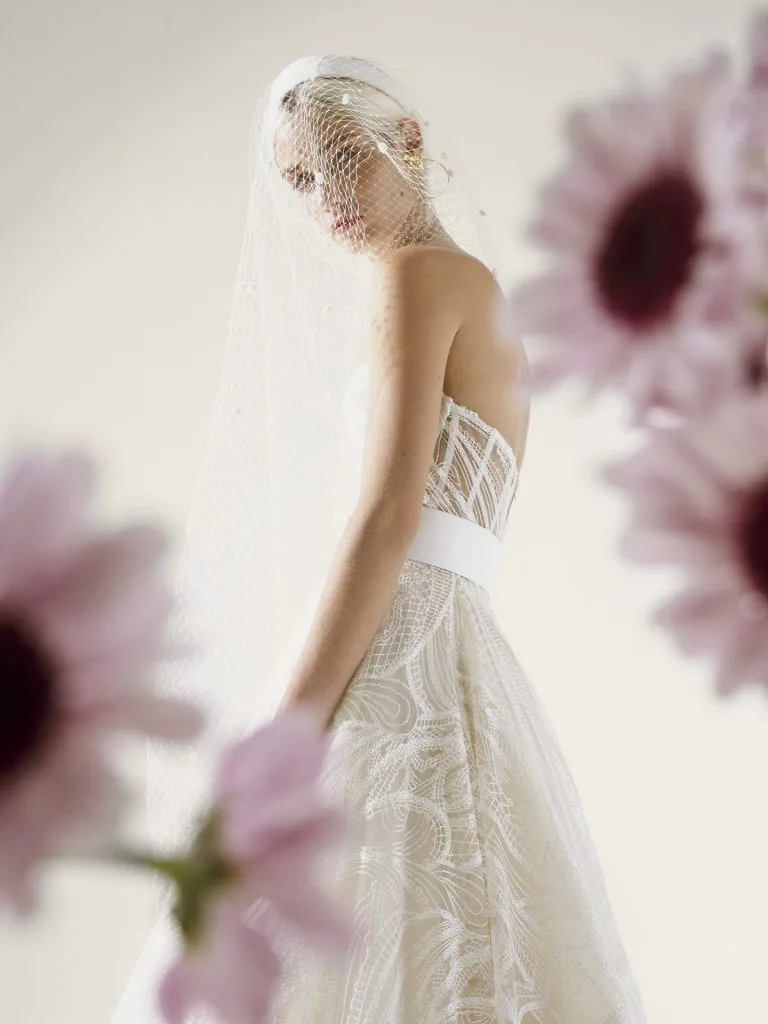 Strapless wedding dress with big princess skirt paired with a belt